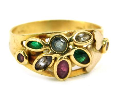 An 18ct gold semi precious stone set dress ring, formed as a flower and set with emerald, sapphire, ruby and diamonds, size O