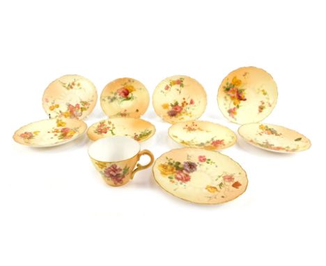 A group of Royal Worcester blush porcelain tea plates and saucers, painted with sprays of flowers, together with a coffee cup