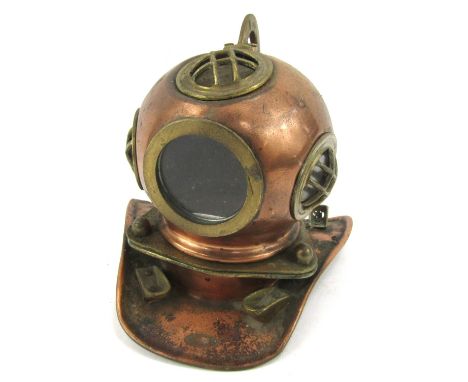 A miniature copper and brass ornamental diving helmet, 17cm high. 