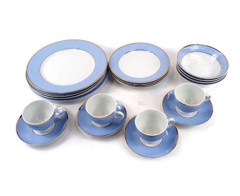 A Royal Doulton part tea service, with a blue gilt rimmed pattern, comprising five dinner plates, four side plates, four cups