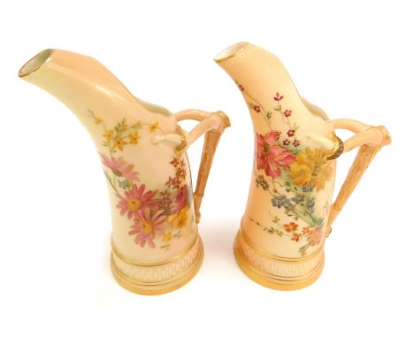 Two Royal Worcester blush porcelain jugs, c1900 and 1903, of tusk form with an antler handle, shape no 1115, each painted wit