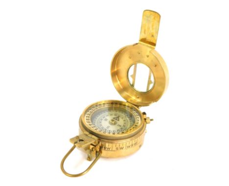 A replica WWII brass compass, stamped to underside T G Co Ltd, London, Mk III 1941, 8cm diameter. 