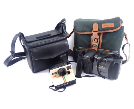 A Sharp View Cam camcorder, and a Polaroid land camera 1000SE, each in carry case. 