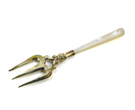 A silver and mother of pearl handled pickle fork, 0.28oz gross.