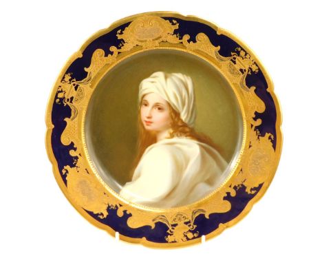 A late 19thC Dresden cabinet plate, with a central painted portrait of Beatrice Cenci, with a royal blue and gilt outer borde