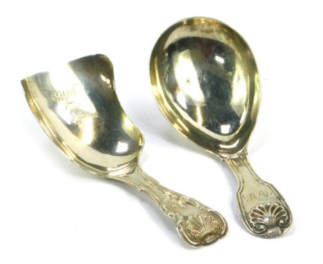 Two Victorian and later silver caddy spoons, comprising a shell capped caddy spoon bearing the initials WCC, London 1808, and