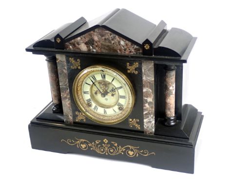 A late 19thC black slate mantel clock, with an arched top, with mottled marble design, an open work movement with cream Roman