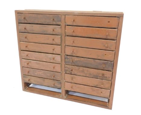A 20thC painted pine tool chest, of sixteen drawers, 78cm high, 86cm wide, 23cm deep. 