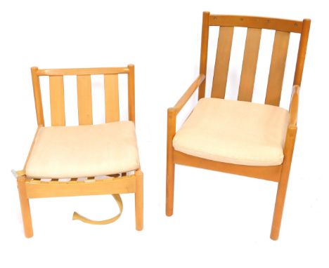 A beech Ercol armchair, with slatted back, on turned supports, and a matching side chair. (AF) The upholstery in this lot doe