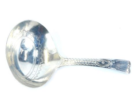 A George III silver caddy spoon, the oval bowl and handle with bright cut decoration, London 1796, 0.32oz.