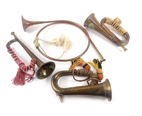 Four brass bugles, comprising a Western Australia Regiment copper and brass bugle, 31cm long, one unmarked example, a brass t