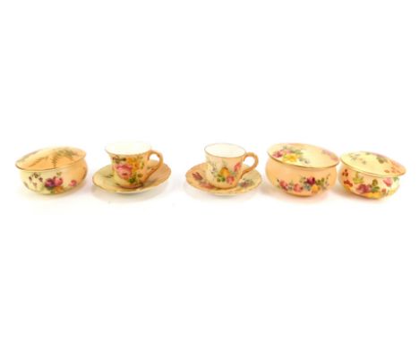A group of Royal Worcester blush porcelain, comprising two miniature coffee cups and saucers, and three dressing table circul