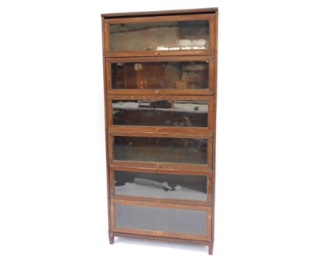 A Globe Wernicke style oak six section bookcase, with glazed up and over doors, raised on square feet, 192cm high, 87cm wide,