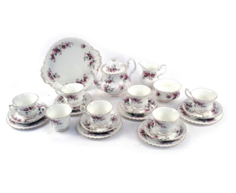 A Royal Albert Lavender Rose pattern part tea service, comprising cake plate, six side plates, six cups and saucers, milk jug