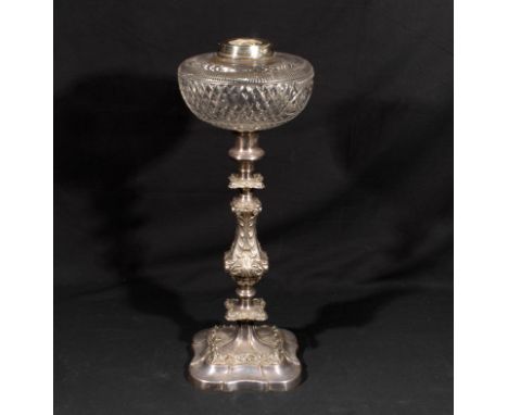 A Victorian cut glass oil lamp on silver plated base.