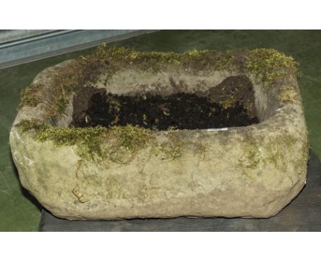 An antique stone trough.