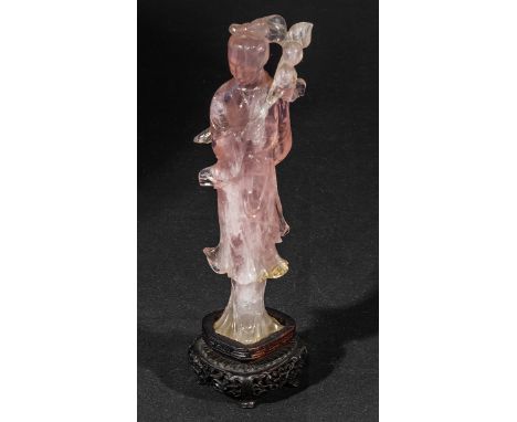 A pink quartz figure on stand. 20cm.
