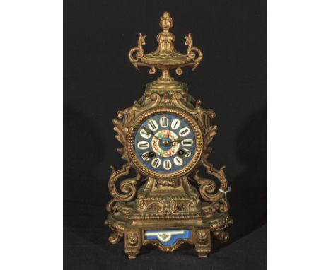 A French gilt metal mantle clock with painted porcelain panels, 12.5" high. Movement stamped Japy - Freres Paris