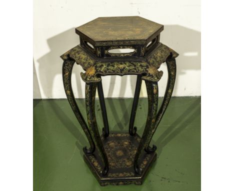 A Chinese lacquered stand with decoration.