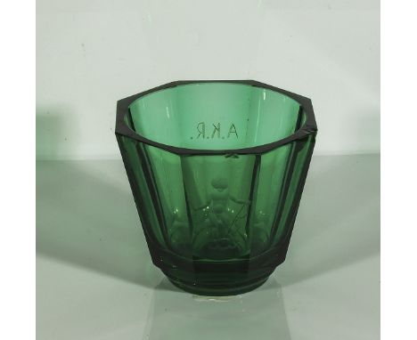 An Orrefors green glass faceted vase with engraved intaglio of Cupid, signed and dated 1936