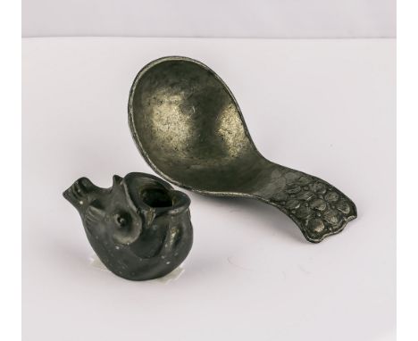 A Danish pewter caddy spoon and fish shaped candle holder