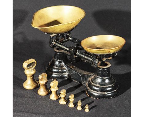 A set of cast weigh scales with weights