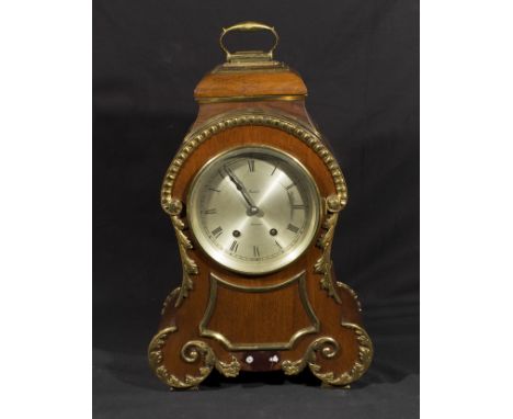 A brass mounted bracket clock.