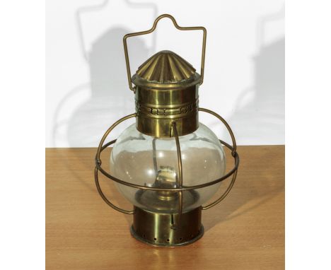 A brass hanging oil lantern