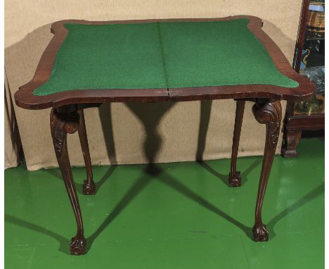 An early 20th century mahogany card table.