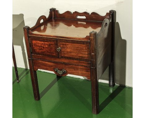 A Georgian mahogany commode with pull front.