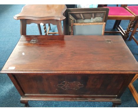 A stained wood blanket chest, stained wood occasional table, firescreen, swivel mirror.