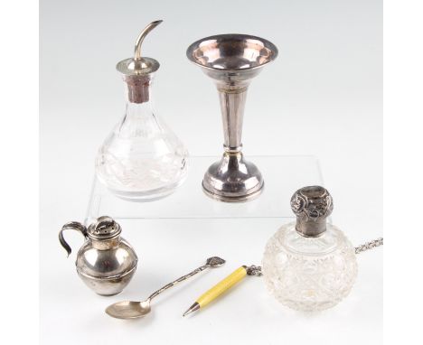 A collection of hallmarked silverware, to include lidded jars, a weighted bud vase, a pepperette, a spoon, together with a ye