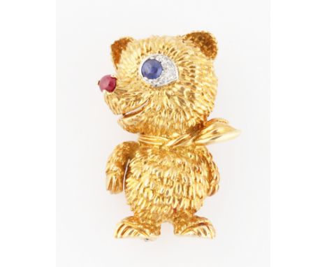 A 1960s Cartier 18ct yellow gold novelty bear brooch, designed as a bear wearing a neckerchief, set with a sapphire cabochon 