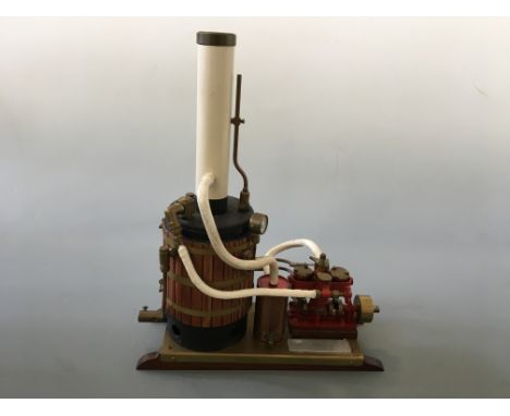 A model by Arnold Clarke, An engine with upright boiler on brass plate