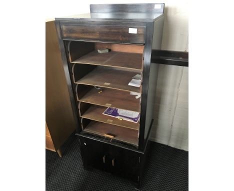 A stained wood timber front music cabinet.