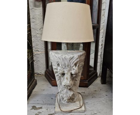 A large composite stone lion mask table lamp. H.105 W.44 D.44cm. (Height includes shade). 