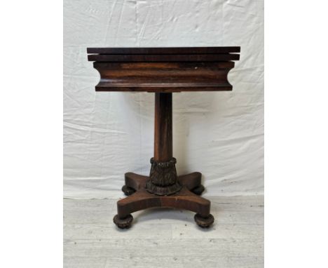 A William IV rosewood fold over top chess and card table raised on faceted column and acanthus carved quadruped base. H.73 W.