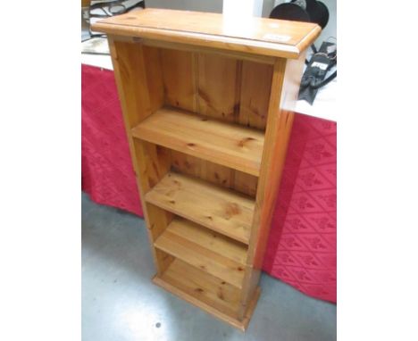 A small 4 shelf pine book case