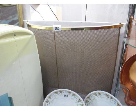 A brass fireguard