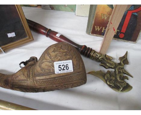 An ornamental axe and a wine/ale flask