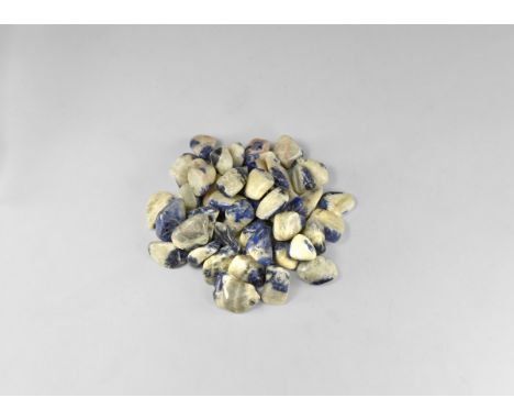 A group of fifty 'tumblestone' pebbles, calcite (white) with sodalite (blue). See Bonewitz, Dr. Ronald Louis, Rocks &amp; Min