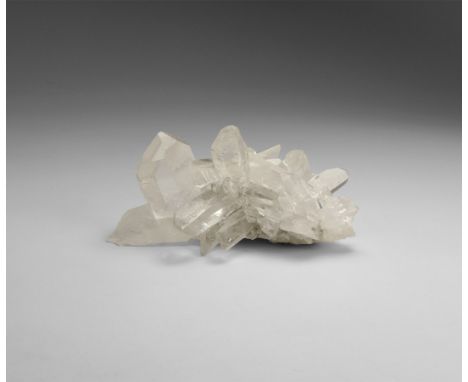 An exceptional formation of transparent quartz crystals, in white card box. 70 grams, 76mm (3"). From the historic ‘Victorian