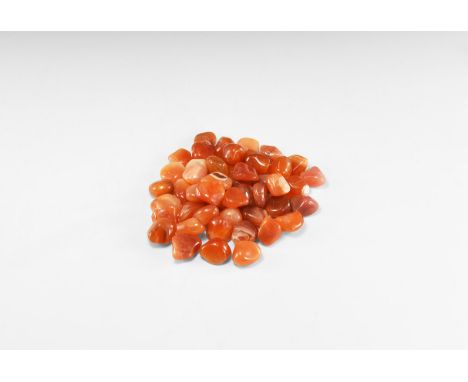 A group of fifty 'tumblestone' orange Botswana agate pebbles. See Bonewitz, Dr. Ronald Louis, Rocks & Minerals, 2008, p.230-2