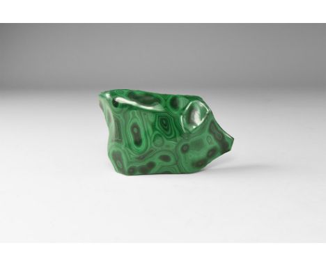 A cut and polished malachite specimen, with concentric circles of dark and pale green. 82 grams, 70mm (2 3/4"). From the hist