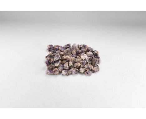 A group of fifty dark purple and white amethyst pieces. 1.46 kg total, 39-44mm (1 1/2 - 1 3/4"). From the historic ‘Victorian