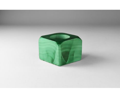 A squarish cut and polished malachite with hole for a candle to the centre. 494 grams, 62mm (2 1/4"). From the historic ‘Vict