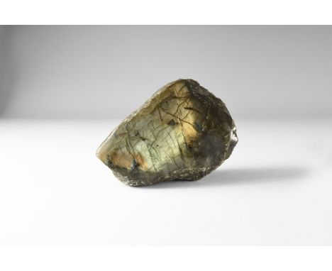 A polished labradorite boulder with rich colour play on most faces, principally greens and golds. 564 grams, 10.9cm (4 1/4").
