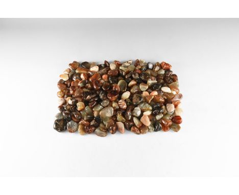 A large group of mixed polished agate and carnelian, mostly in brown, red and cream colour. 3.41 kg total, 30-40mm (1 1/4 - 1