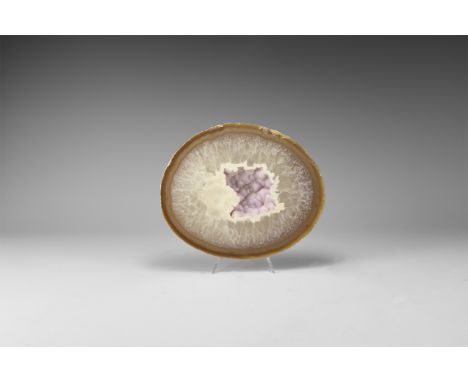 A fine cut and polished agate slice with layer of quartz, agate and centre filled with pink quartz crystals. 534 grams, 15.8c