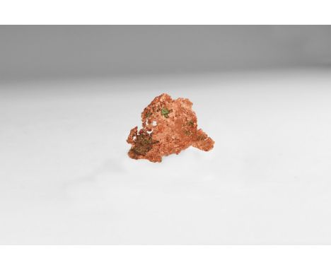 A fine thin sheet of native copper in white card tray with label reading: 'NATIVE COPPER, Caledonia Mine, Ontonagon Co, MI', 